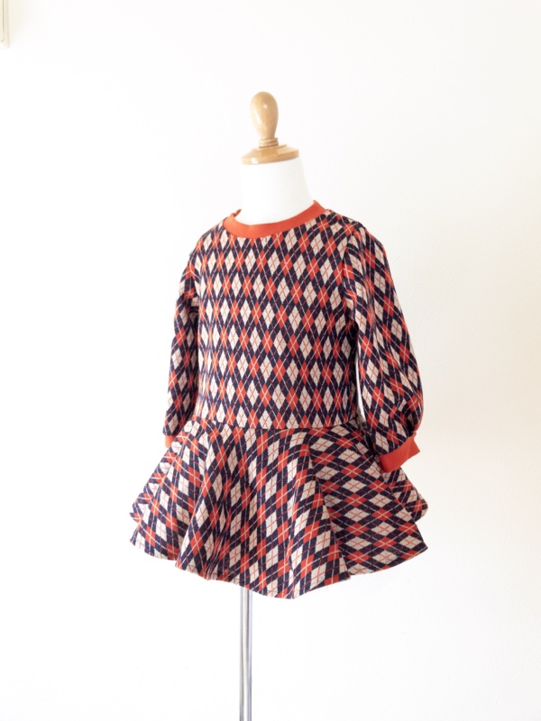アーガイル模様のペプラムチュニック